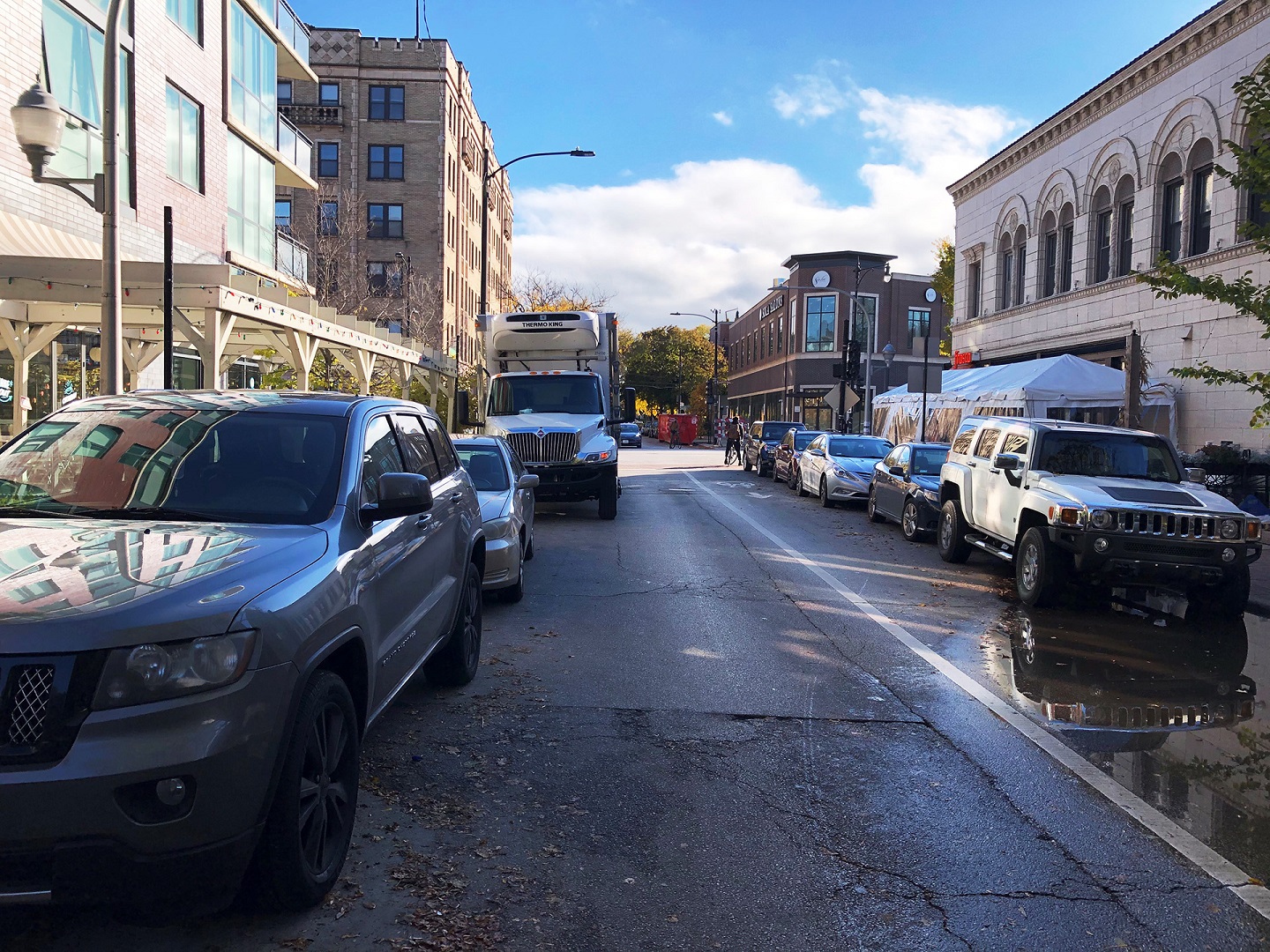 Photo of a street with cars and trucks
