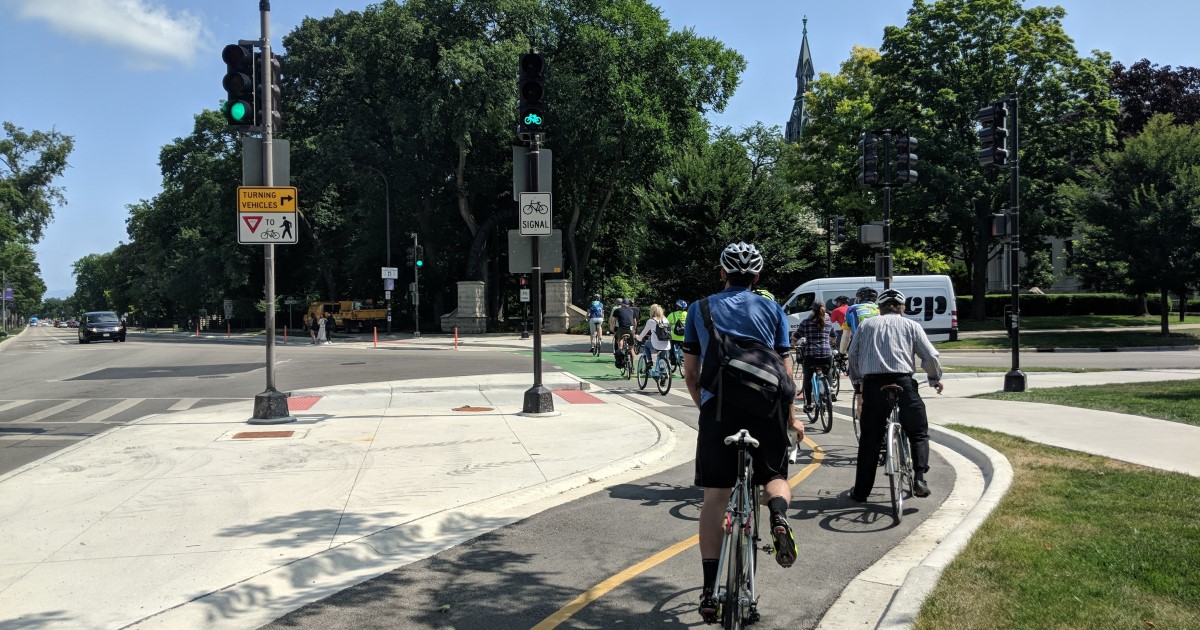 People on bicycles in bike lane
